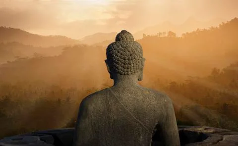 Statue of Buddha at sunset, Borobudur, Java, Indonesia Stock Photos