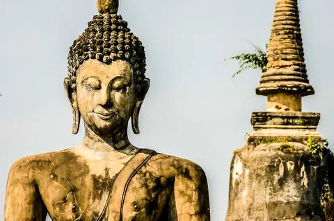A statue of a Buddha with a white background Stock Photos