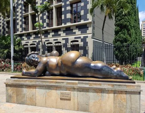 Statue called Woman with a Mirror in Botero Square in Medellin 写真素材