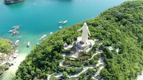Statue of Christ the Savior Drone shot ,Hundred islands National Park Philippine Stock Footage 134783110