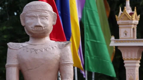 Statue with colorfull flags in the background Stock Footage 241349466