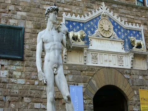 The statue of David and the marble frontispiece of Palazzo Vecchio Video stock 83730866