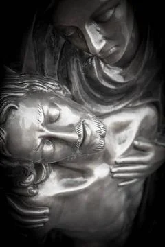 Statue of dead Jesus Christ being embraced by the Virgin Mary Bronze Statu... Stock Photos