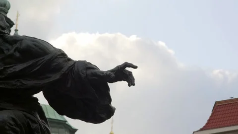 Statue dramatically points finger, Jan Hus Memorial, Prague old town square Stock Footage 70723703
