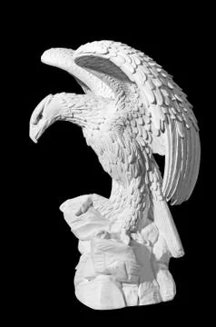 Statue of an eagle on a black background Stock Photos