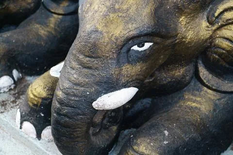 Statue of an elephant with a formidable face close-up Stock Photos