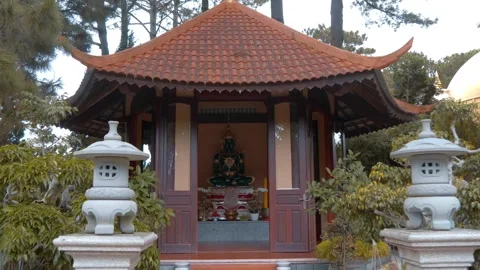 A statue of Emerald or Jade Buddha sitting in Trúc Lâm Zen Monastery Stock Footage 333374619