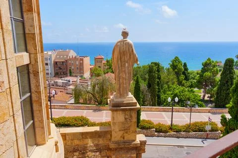 Statue of Emperor Caesar Augustus Overlooking Beautiful Tarragona Coastline and Stock Photos