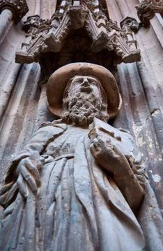 Statue on a facade of a cathedral Stock Photos