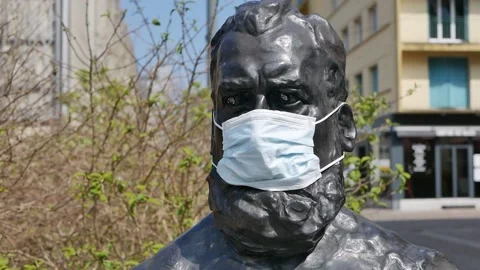 Statue with Face Covered with a Protective Facemask in the Fight Against COVID Stock Footage 152738696