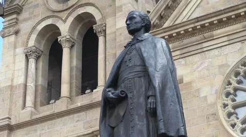 A statue in front of  the cathedral in Santa Fe, New Mexico. Stock Footage 58061912
