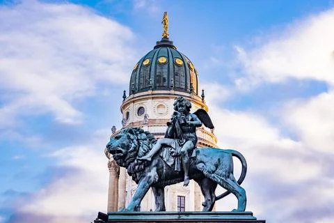 Statue in front of dome at gendarmenmarkt Stock Photos