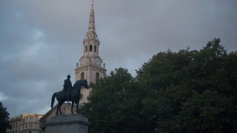 Statue of George IV and Clock Tower of St Martin in the Fields Stock Footage 220000042