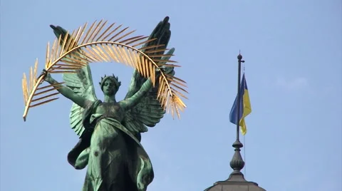 Statue of Glory and flag of Ukraine, on top of Lviv Opera Stock Footage 52030834