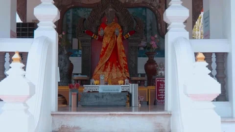 A statue of Goddess Uma Devi (Mother Uma) in colorful orange golden saree  Stock Footage 308889291