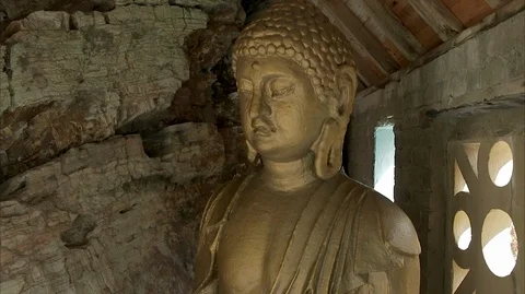 Statue of a Golden Buddha Stock Footage 128497343