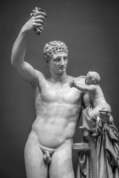 Statue with grapes, classical pose, original more than 1600 years old Stock Photos