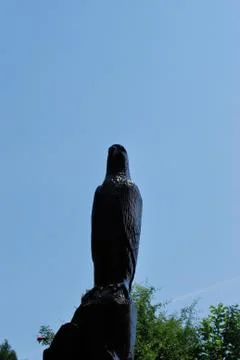 Statue hidden in a tree Stock Photos