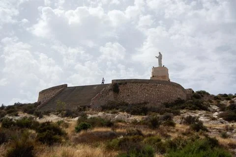 Statue on Hill with Steps and Cloudy Sky Stock Photos