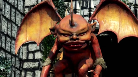 Statue of horrible imp with red wings Stock Footage 61988132