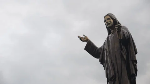 Statue of Jesus on a background of clouds Stock Footage 27310351