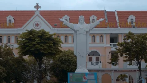 Statue of Jesus Christ with raised hands near the Pink Church  Video stock 330893929