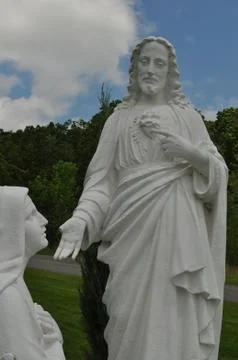 Statue of Jesus Looking Down Upon the Virgin Mary Stock Photos
