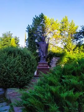 Statue of John Paul II next to St Peter and Paul cathedral Stock Photos