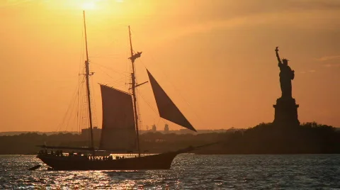 Statue of Liberty and historic sail boat Stock Footage