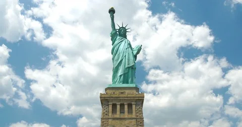 Statue of Liberty on the background of cloudy beautiful sky - facing central Stock Footage 70276829