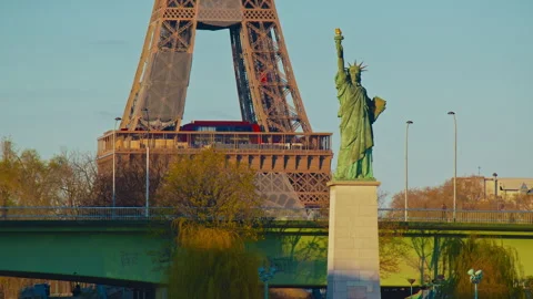 The Statue of Liberty background on the Eiffel Tower. Paris, France. Timelapse Stock Footage 320140732