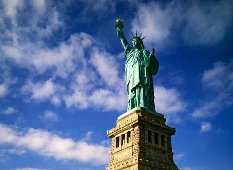 Statue of liberty with clouds Stock Photos