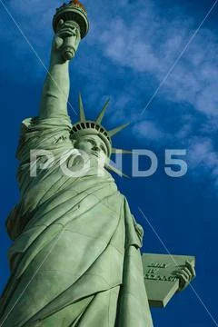 The Statue of Liberty is a colossal copper statue designed by Auguste Bartholdi Stock Photos