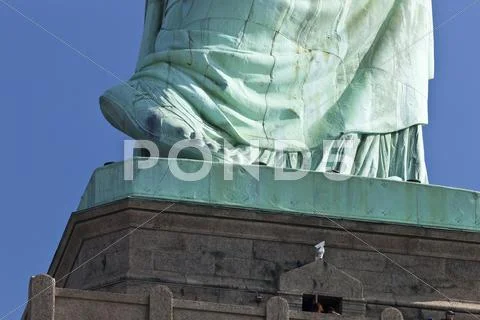 Photograph: The Statue of Liberty the Detail of the foot #46447232