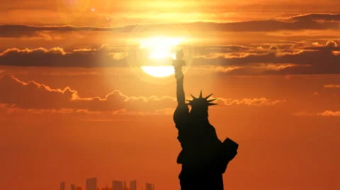 Statue of Liberty in Dramatic Sunset with Sun Behind Torch