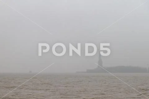 Statue of Liberty in fog Stock Photos
