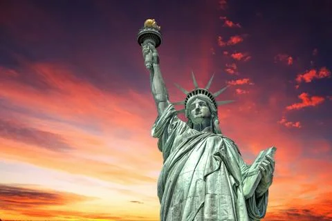 Statue of liberty in New York on dramatic post nuclear war sky background Stock Photos