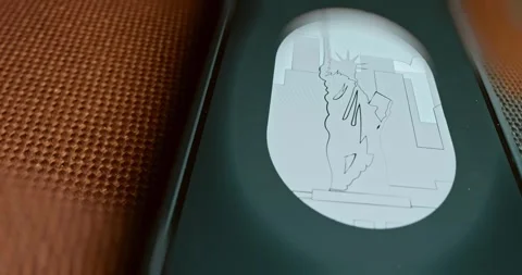 The Statue of Liberty seen through the airplane window, presentation Stock Footage 313494551