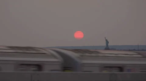 Statue of Liberty subway train elevated track sunset 4K New York City NYC Stock Footage 41674372