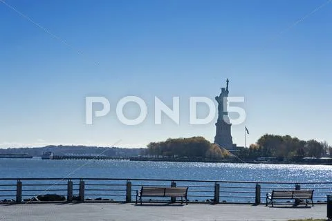 Statue of liberty at sundown Stock Photos