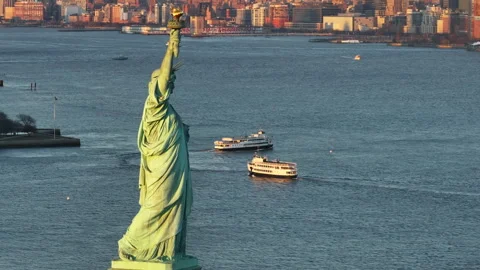 The Statue of Liberty at sunset Stock Footage 303432703