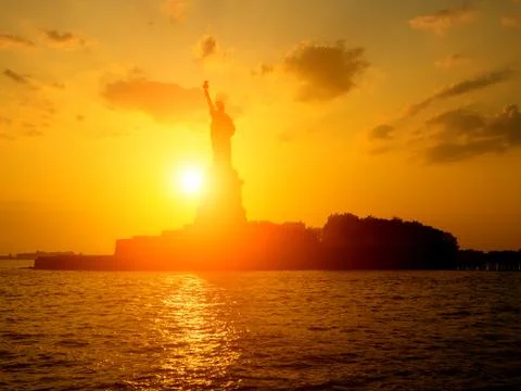 The Statue of Liberty at sunset Stock Photos
