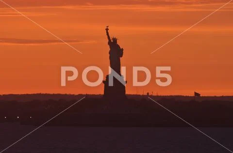 Statue of Liberty at Sunset Stock Photos