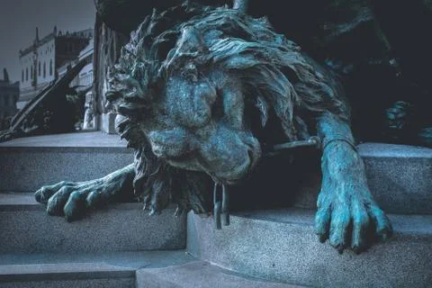 Statue of a lion in chains Stock Photos