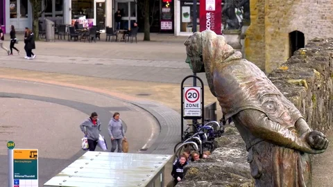 Statue looks down from walls at time lapsed people Video stock 72956137