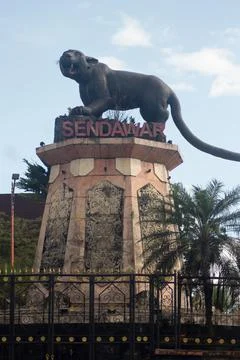 Statue of the "Macan Dahan" figure (clouded leopard of borneo). Stock Photos