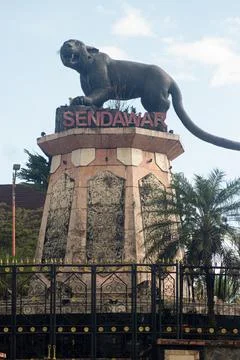 Statue of the "Macan Dahan" figure (clouded leopard of borneo). Stock Photos