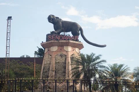 Statue of the "Macan Dahan" figure (clouded leopard of borneo). Stock Photos