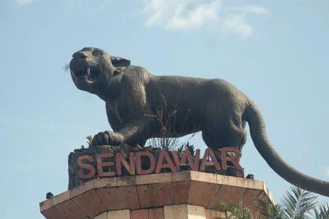 Statue of the "Macan Dahan" figure (clouded leopard of borneo). Stock Photos