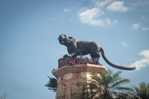Statue of the "Macan Dahan" figure (clouded leopard of borneo). Stock Photos